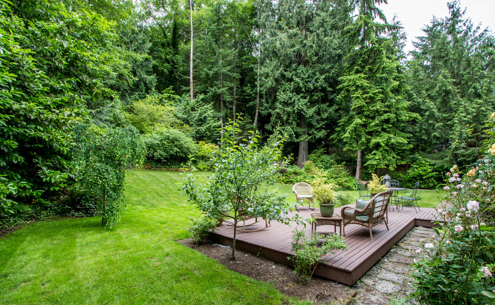 Example of a large cottage backyard deck design in Seattle