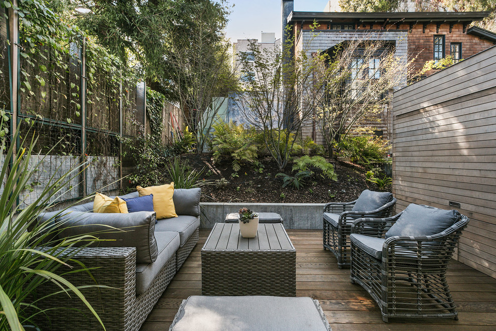 Inspiration for a timeless backyard deck container garden remodel in San Francisco with an awning