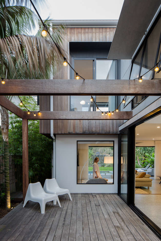 Photo of a contemporary side terrace in Gold Coast - Tweed with a pergola.