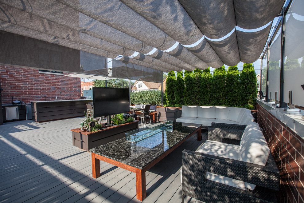 Example of a mid-sized transitional rooftop outdoor kitchen deck design in Chicago with a pergola