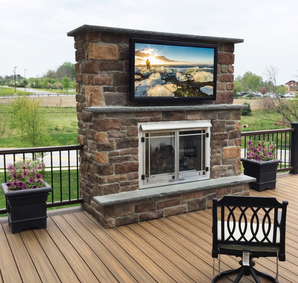 Large elegant backyard deck photo in Philadelphia with a fire pit and no cover