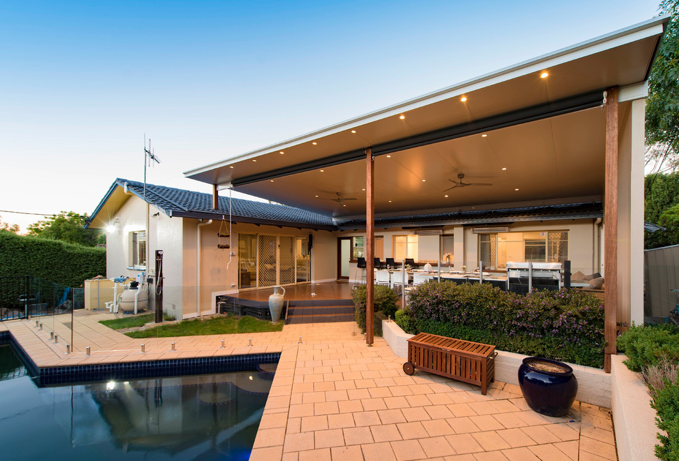 Inspiration for a mid-sized contemporary backyard deck remodel in Canberra - Queanbeyan with a pergola