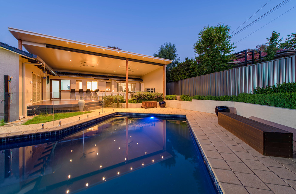 Inspiration for a medium sized contemporary back terrace in Canberra - Queanbeyan with a pergola.