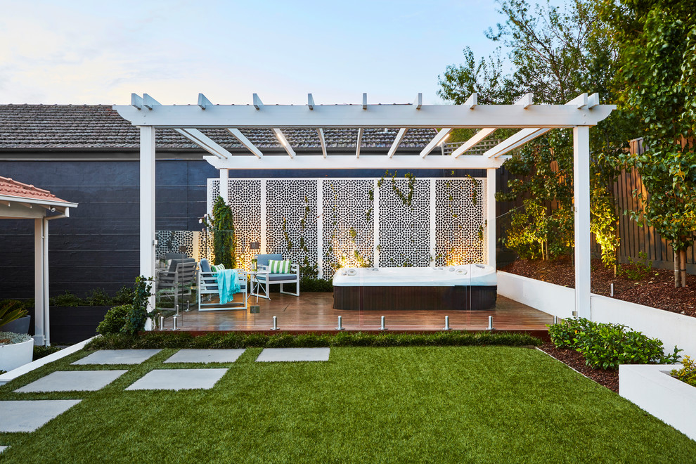 Inspiration for a medium sized contemporary back terrace in Melbourne with a pergola.