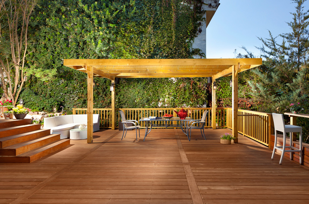 Trendy deck photo in Other with a pergola