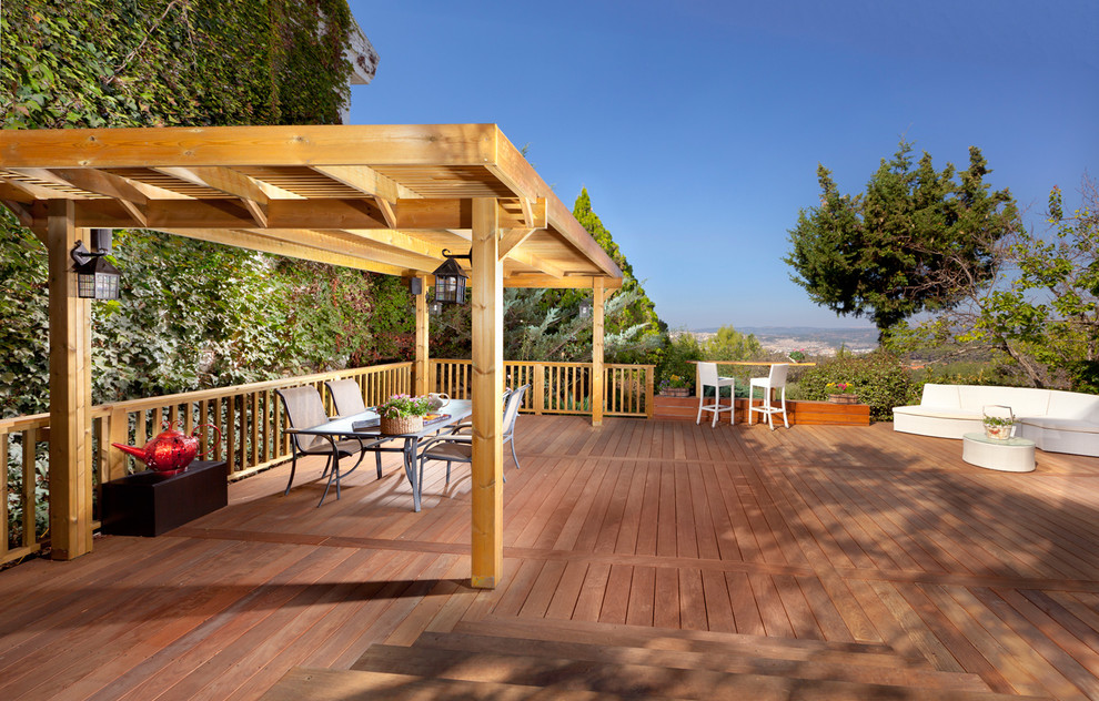 Deck - traditional deck idea in Other with a pergola