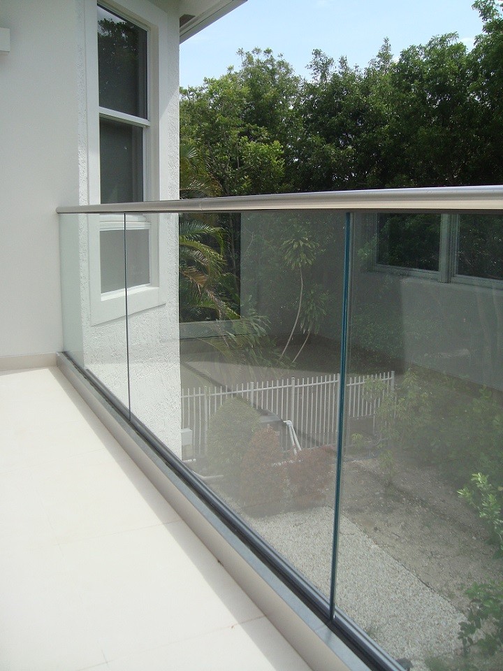 Photo of a small modern back terrace in Tampa with a roof extension.