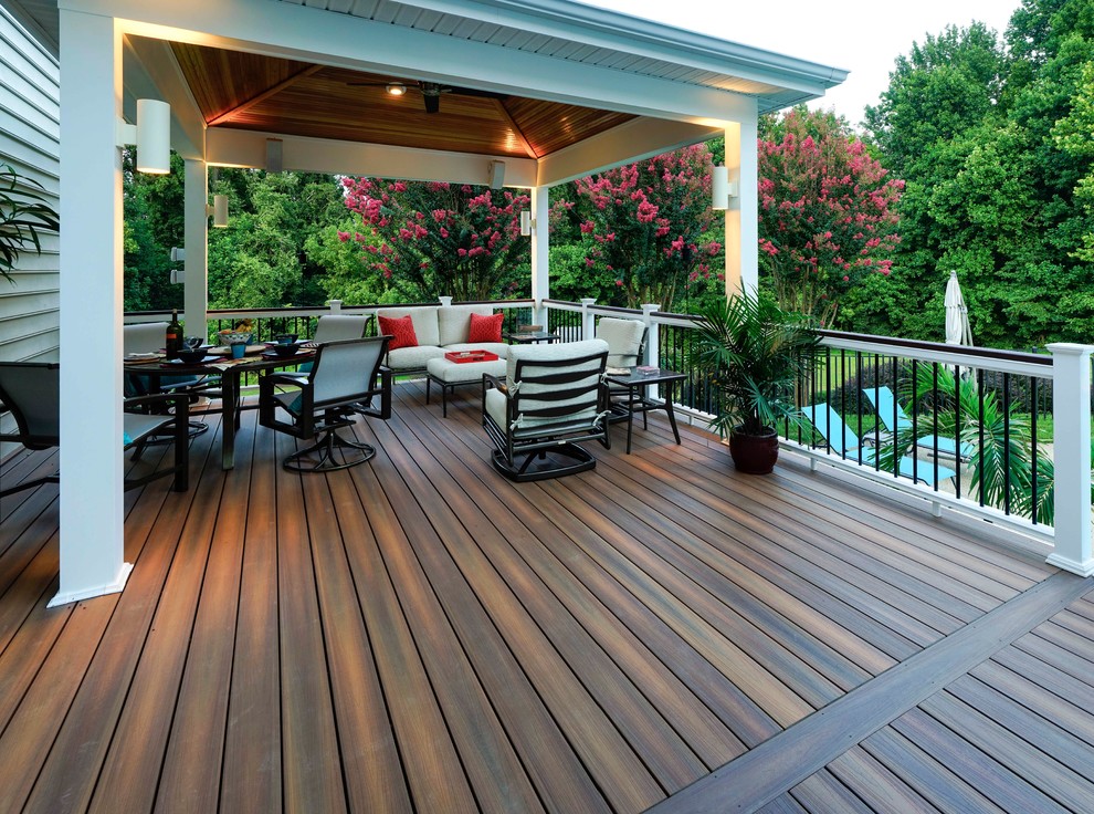 Deck - mid-sized transitional deck idea in Charlotte with a roof extension