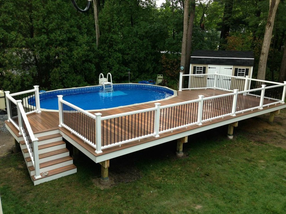 Inspiration for a mid-sized timeless backyard water fountain deck remodel in Boston with no cover