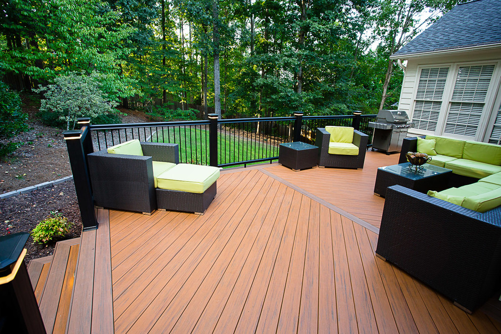 This is an example of a medium sized modern back terrace in Atlanta with an outdoor kitchen.