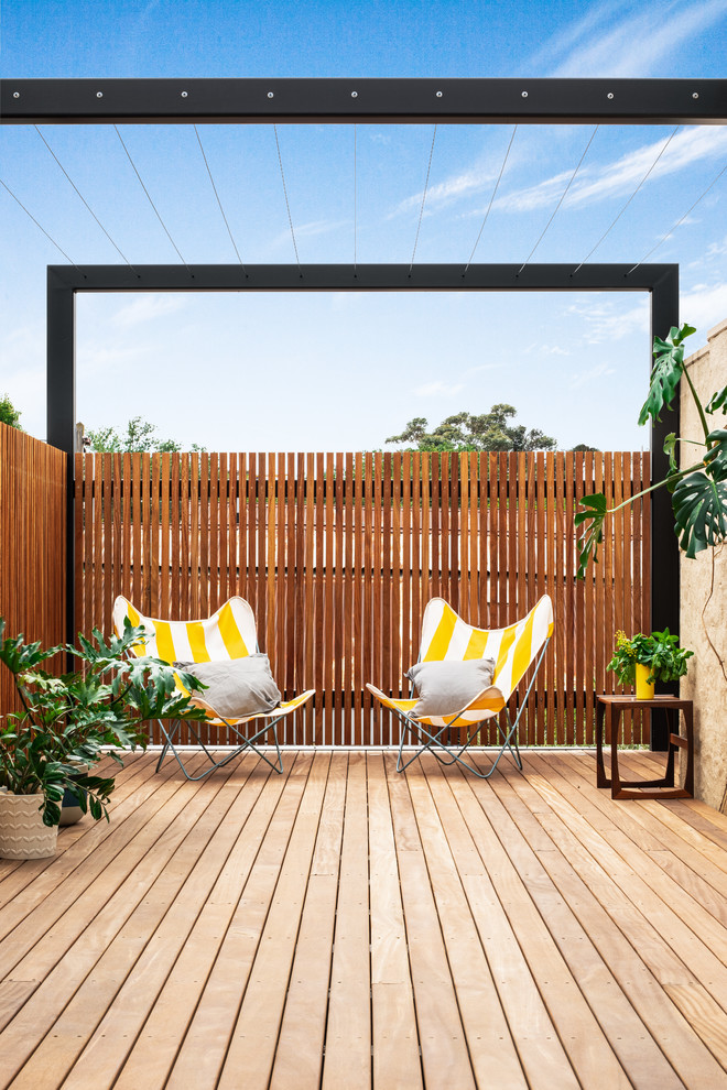 Design ideas for a contemporary terrace in Melbourne with a pergola and fencing.