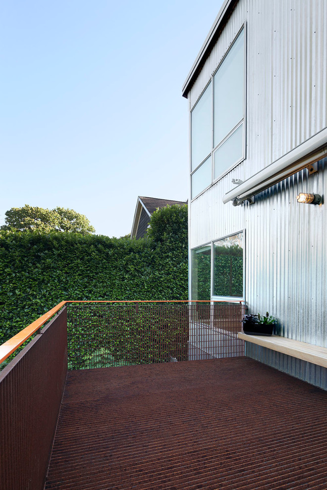Immagine di una terrazza minimal di medie dimensioni e dietro casa con nessuna copertura