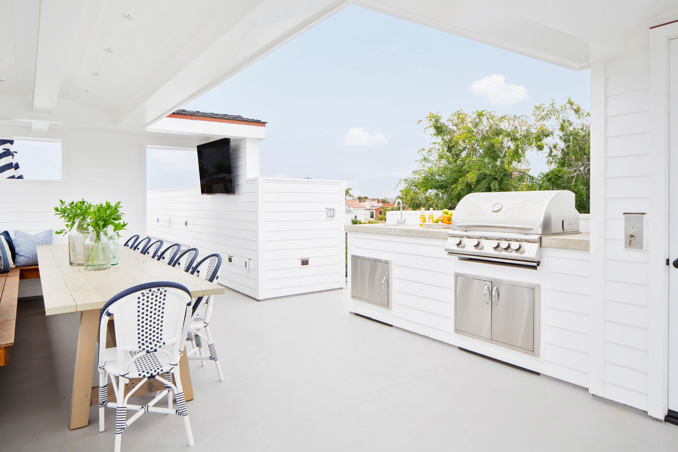 Design ideas for a large farmhouse roof terrace in Orange County with an outdoor kitchen and a roof extension.
