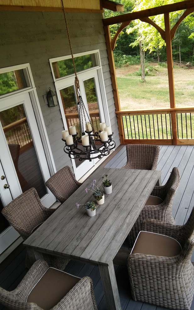 Mid-sized trendy backyard deck photo in Other with a roof extension