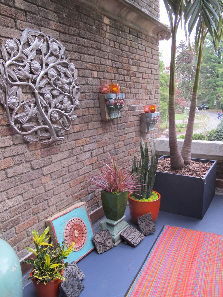 Immagine di una piccola terrazza eclettica sul tetto con un giardino in vaso e nessuna copertura