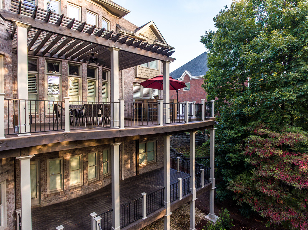 Inspiration for a large classic back terrace in Atlanta with an outdoor kitchen and a pergola.