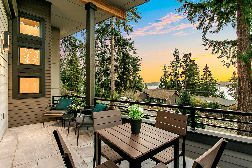 Inspiration for a mid-sized modern deck remodel in Seattle with a roof extension