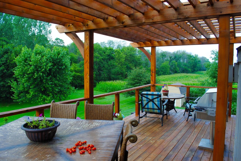 Inspiration for a mid-sized contemporary backyard deck remodel in Indianapolis with a pergola