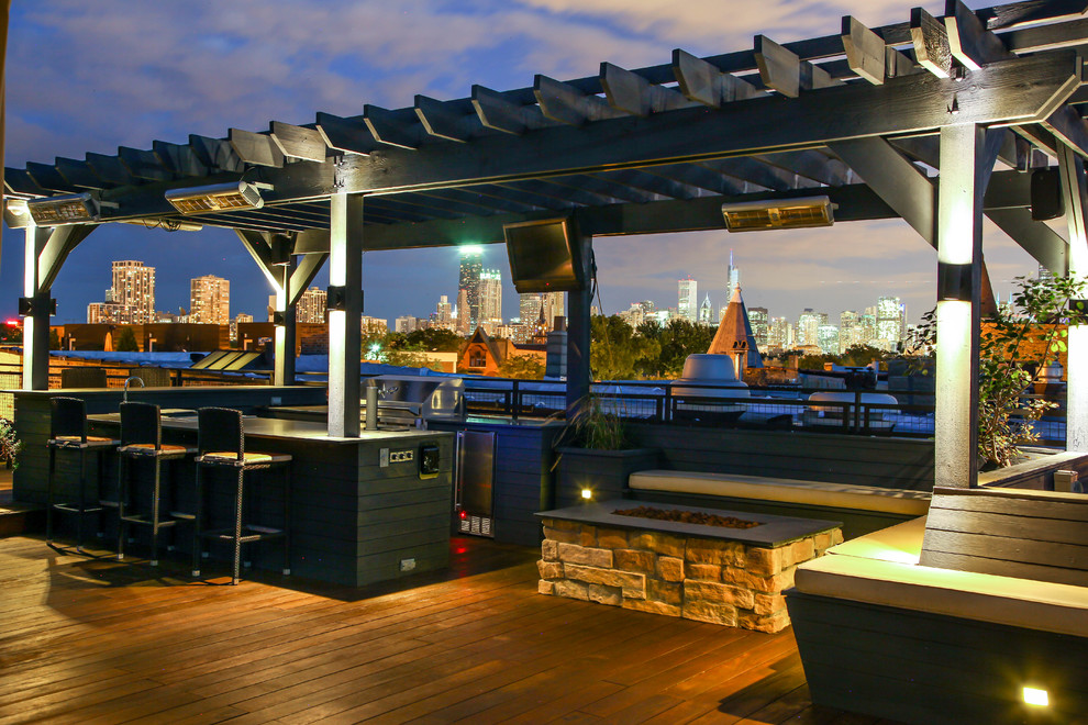 Photo of a contemporary roof terrace in Chicago with an outdoor kitchen and a pergola.