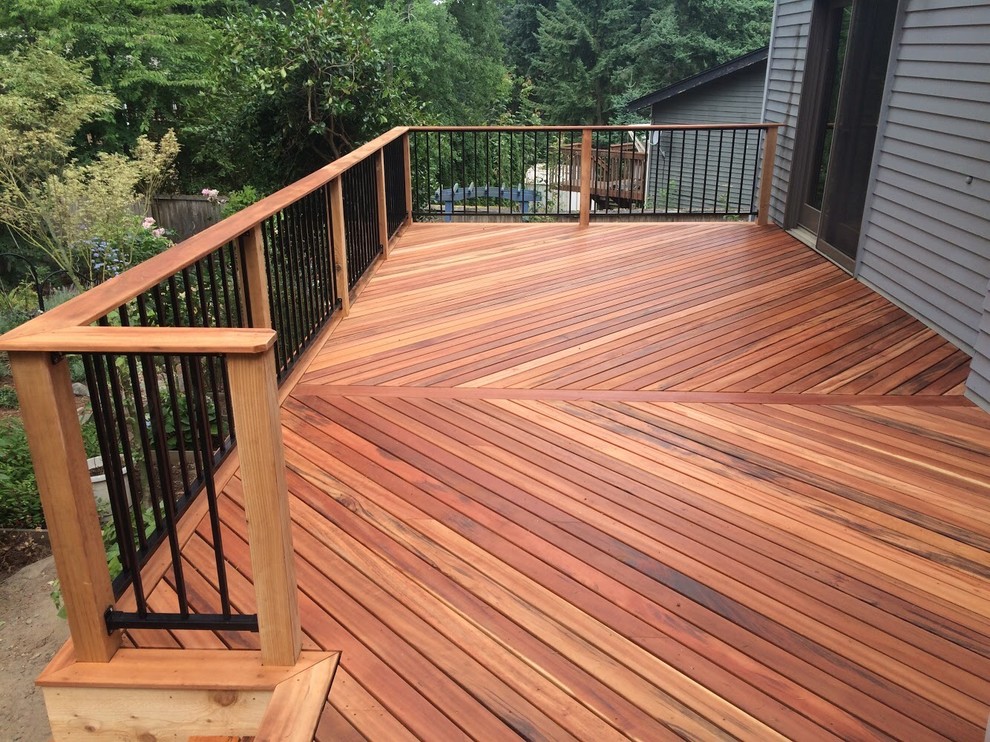 Inspiration for a mid-sized modern backyard deck remodel in Seattle with no cover