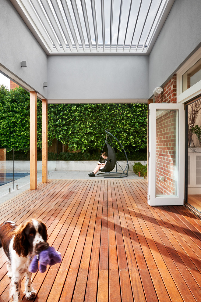 Inspiration for a medium sized contemporary back terrace in Melbourne with an awning.