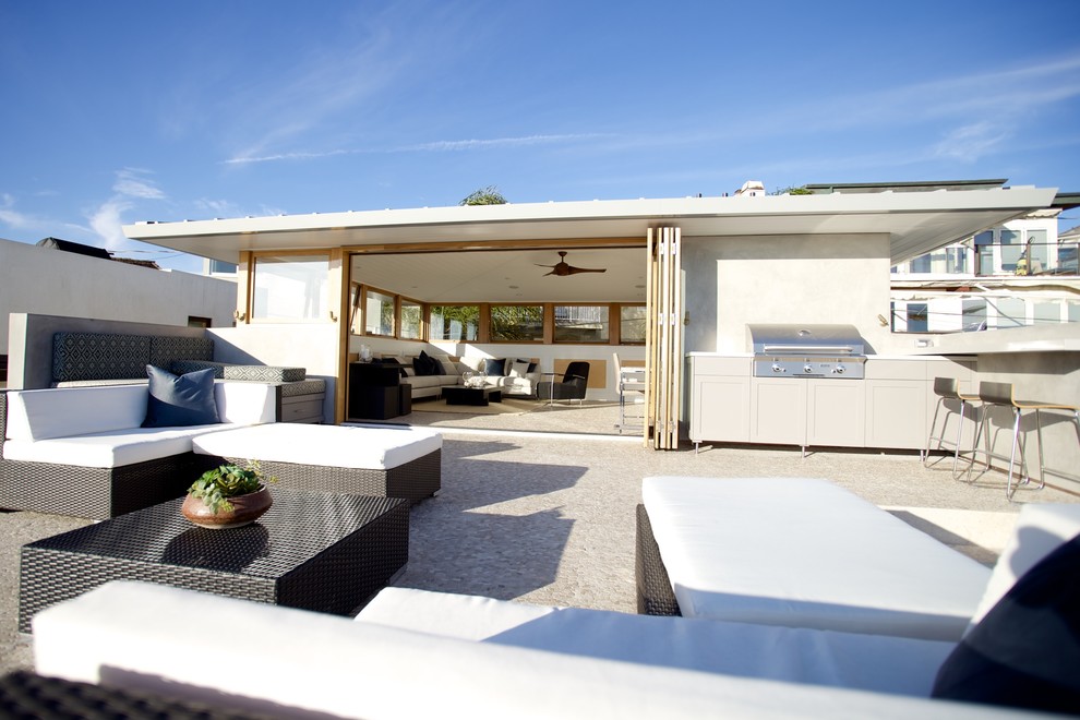 Example of a large beach style rooftop outdoor kitchen deck design in Los Angeles with no cover