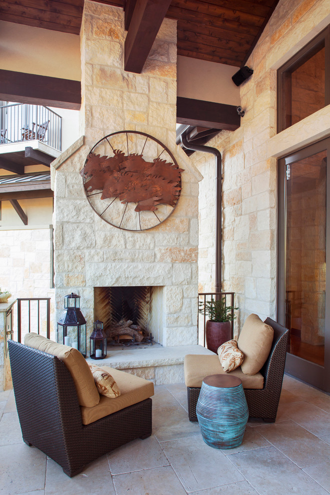 Inspiration for a rustic terrace in Austin with a fire feature.