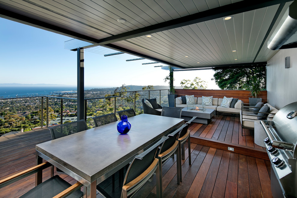 Идея дизайна: терраса среднего размера на боковом дворе в современном стиле с летней кухней и навесом