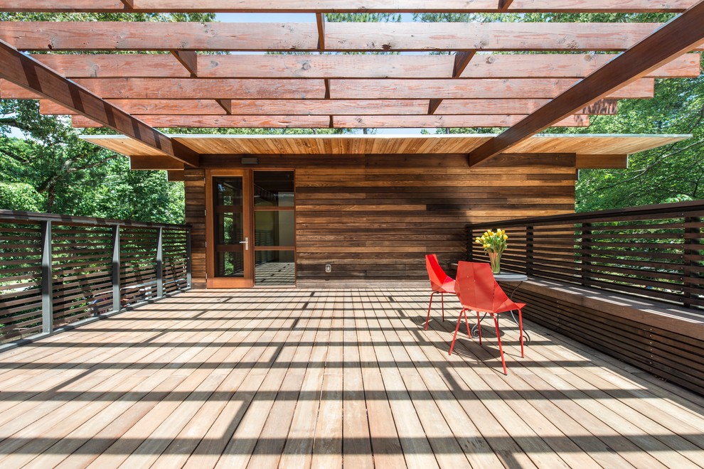 Inspiration pour une terrasse minimaliste avec une pergola.