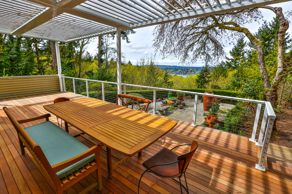 This is an example of a medium sized modern back terrace in Seattle.