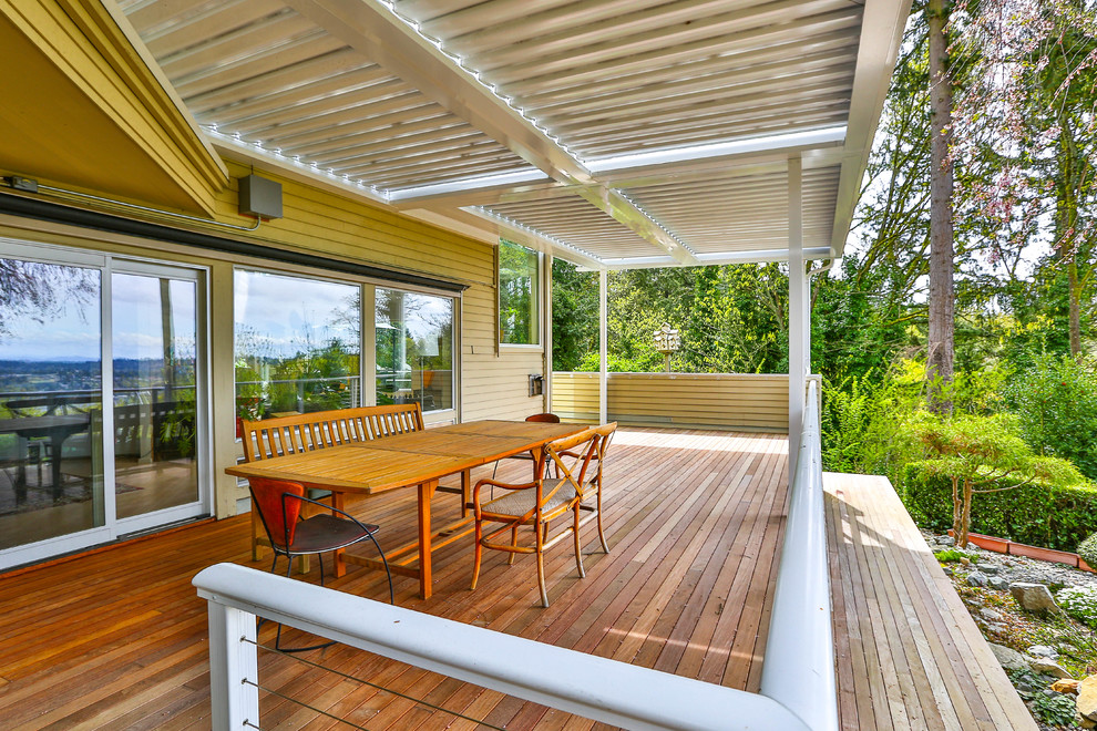 Deck - mid-sized modern backyard deck idea in Seattle