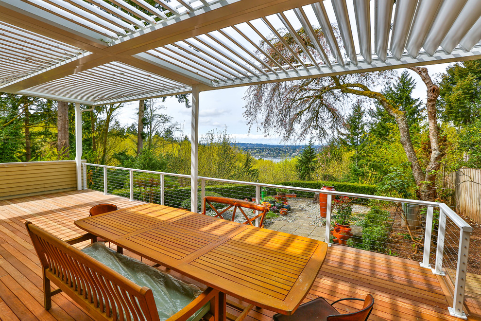 Mid-sized minimalist backyard deck photo in Seattle