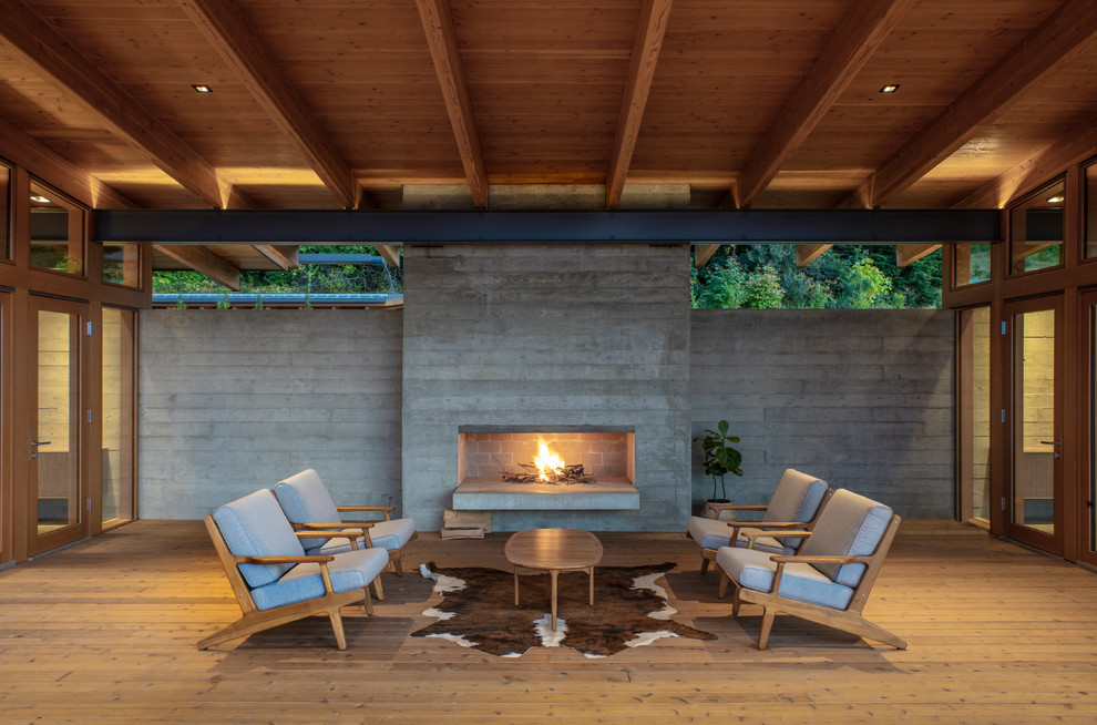 Design ideas for a rustic terrace in Portland with a fireplace and a roof extension.