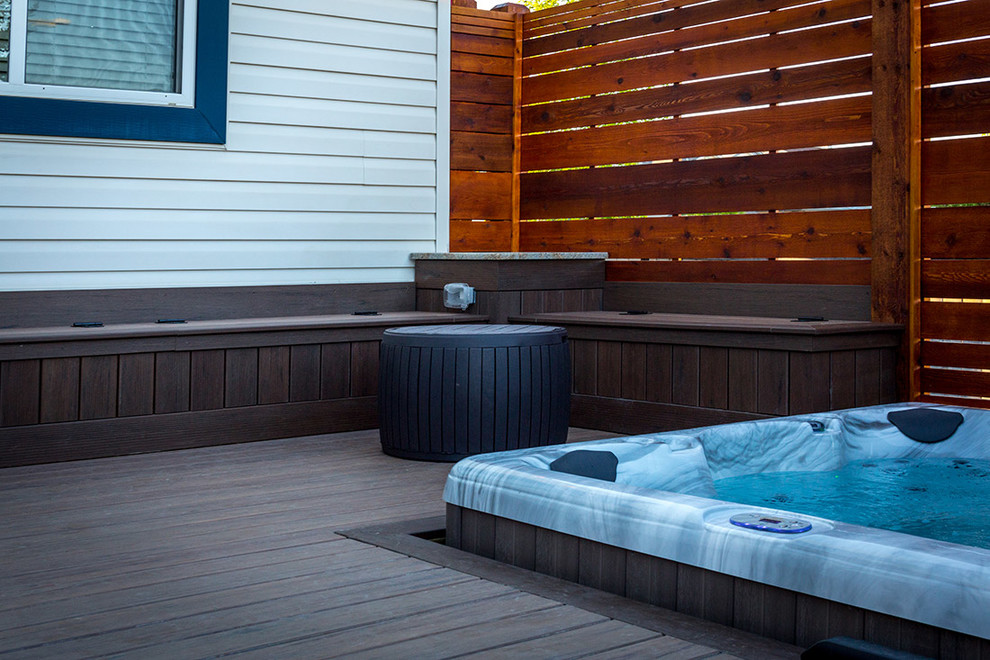 Hot tub area with cedar privacy screens and built in benches