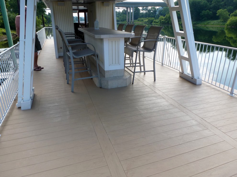 Example of a mid-sized beach style rooftop deck design in Cleveland with no cover