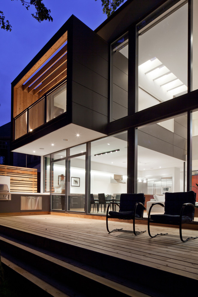 Diseño de terraza moderna sin cubierta en patio trasero