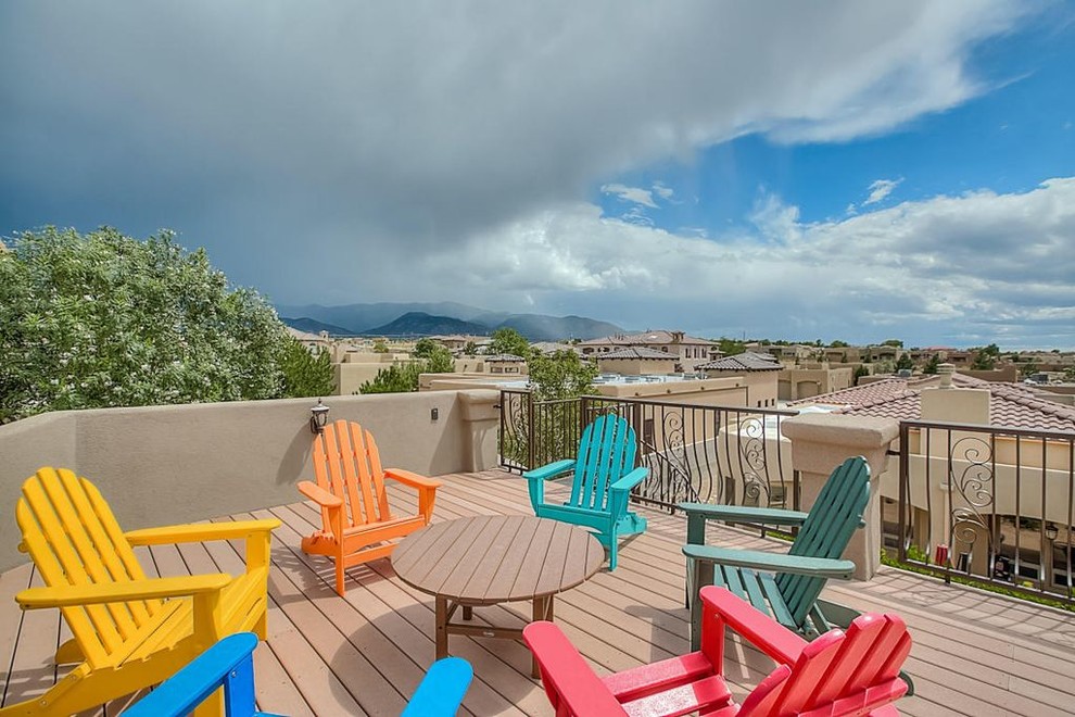 This is an example of a medium sized roof terrace in Albuquerque with no cover.