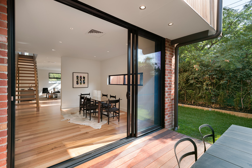 Inspiration for a medium sized contemporary back terrace in Melbourne with a roof extension.