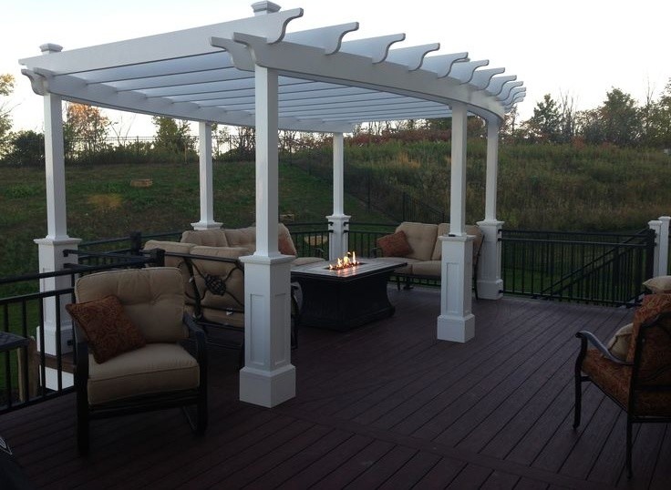 Inspiration for a mid-sized timeless backyard deck remodel in Minneapolis with a pergola and a fire pit