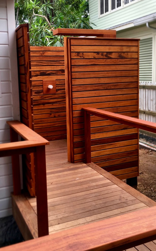 Medium sized world-inspired back terrace in Miami with an outdoor shower and no cover.
