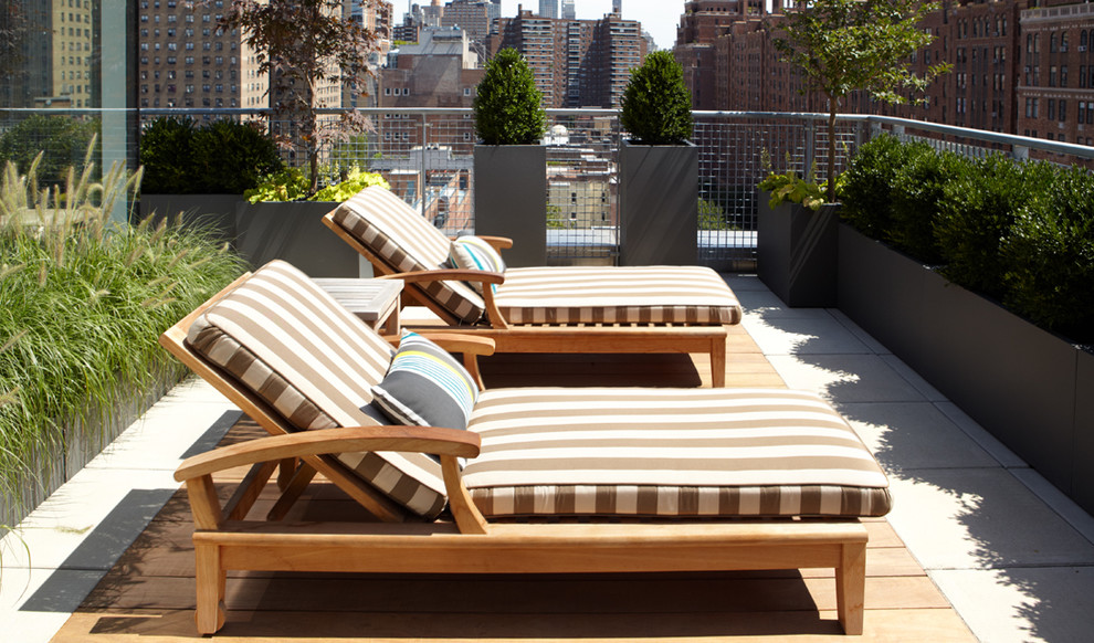 Inspiration for a large contemporary rooftop deck container garden remodel in New York with no cover