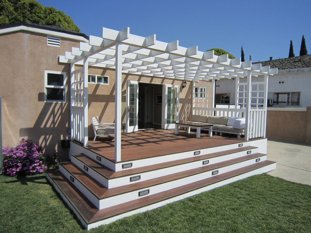 Mid-sized transitional backyard deck photo in Los Angeles with a pergola