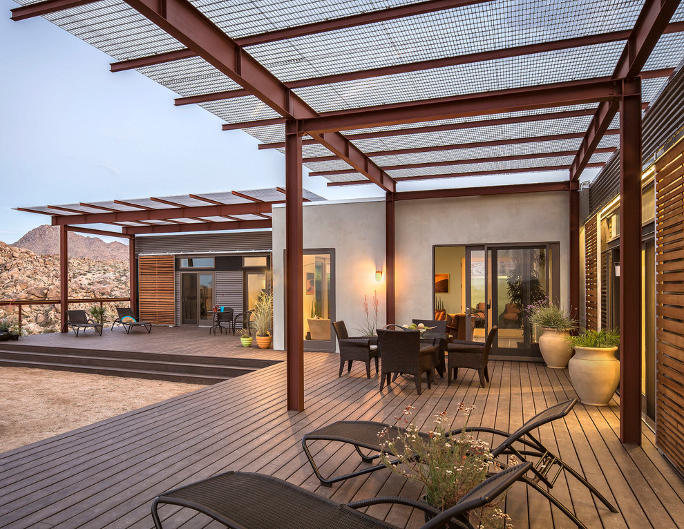 Inspiration for a large contemporary deck remodel in Los Angeles with a pergola