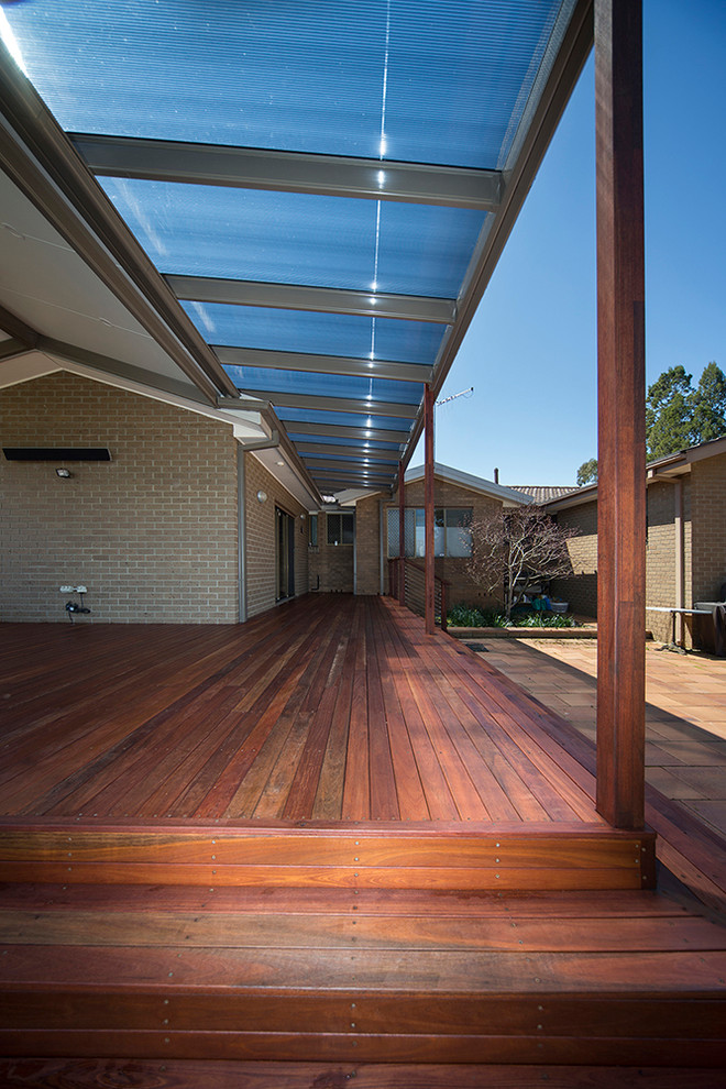 Design ideas for a medium sized modern back terrace in Canberra - Queanbeyan with a pergola.