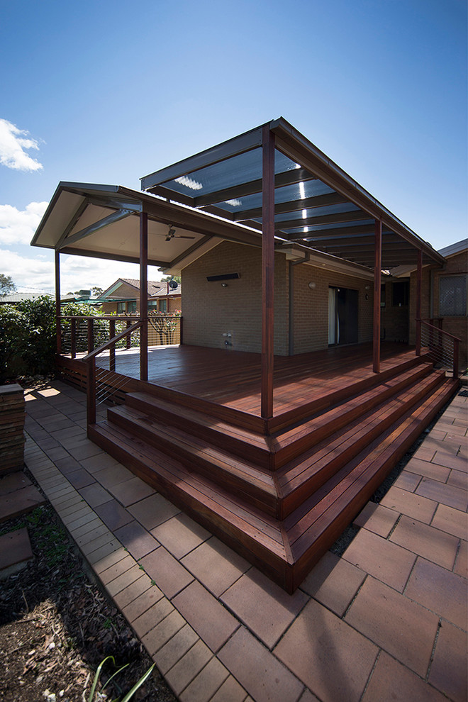 Inspiration for a medium sized modern back terrace in Canberra - Queanbeyan with a pergola.