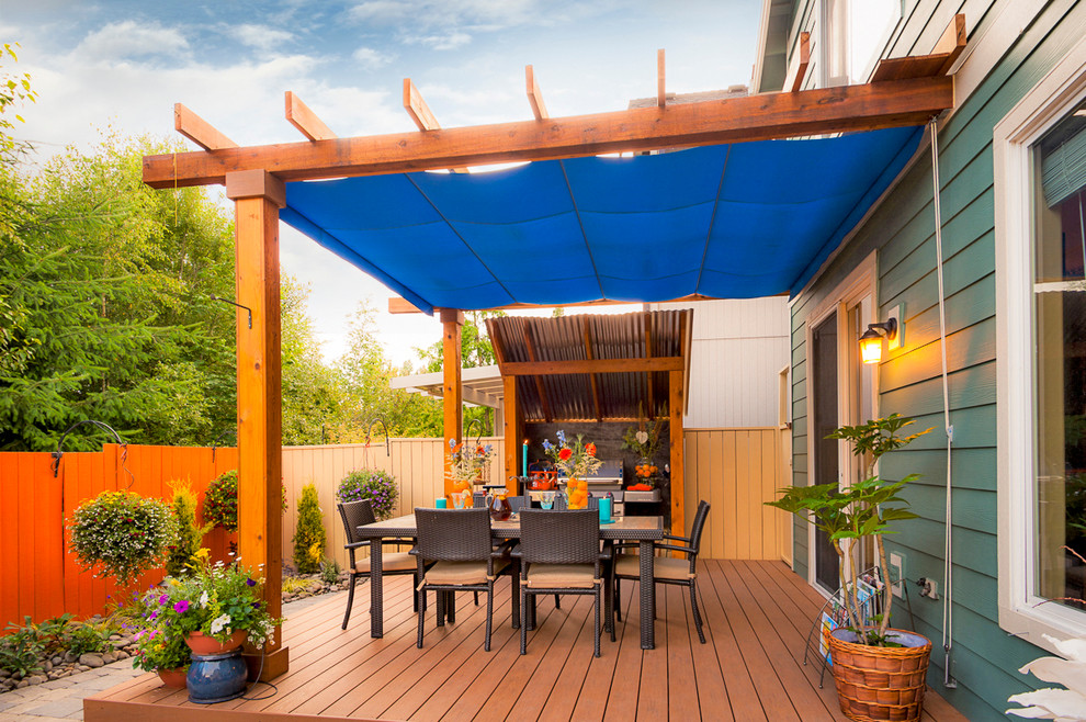 Transitional outdoor kitchen deck photo in Portland