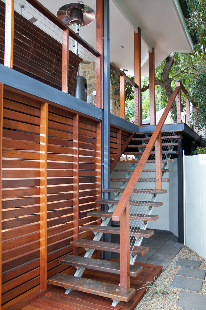 Photo of a large contemporary terrace in Brisbane with a roof extension.