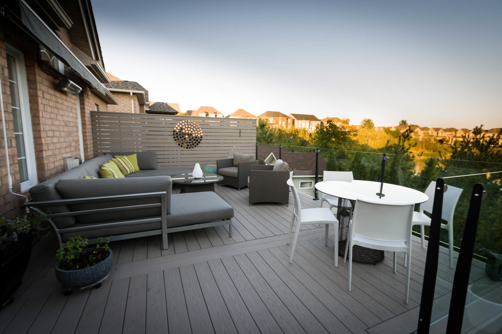 Inspiration for a mid-sized contemporary backyard deck remodel in Toronto with no cover