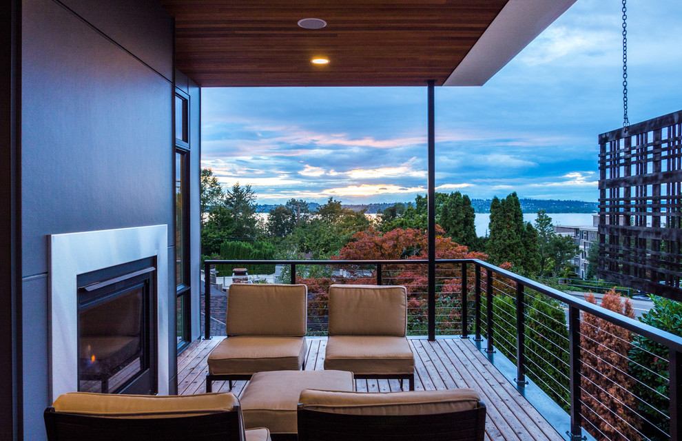 Inspiration for a contemporary terrace in Seattle with a fire feature and a roof extension.
