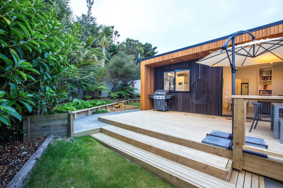 Photo of a medium sized contemporary back terrace in Auckland with an awning.